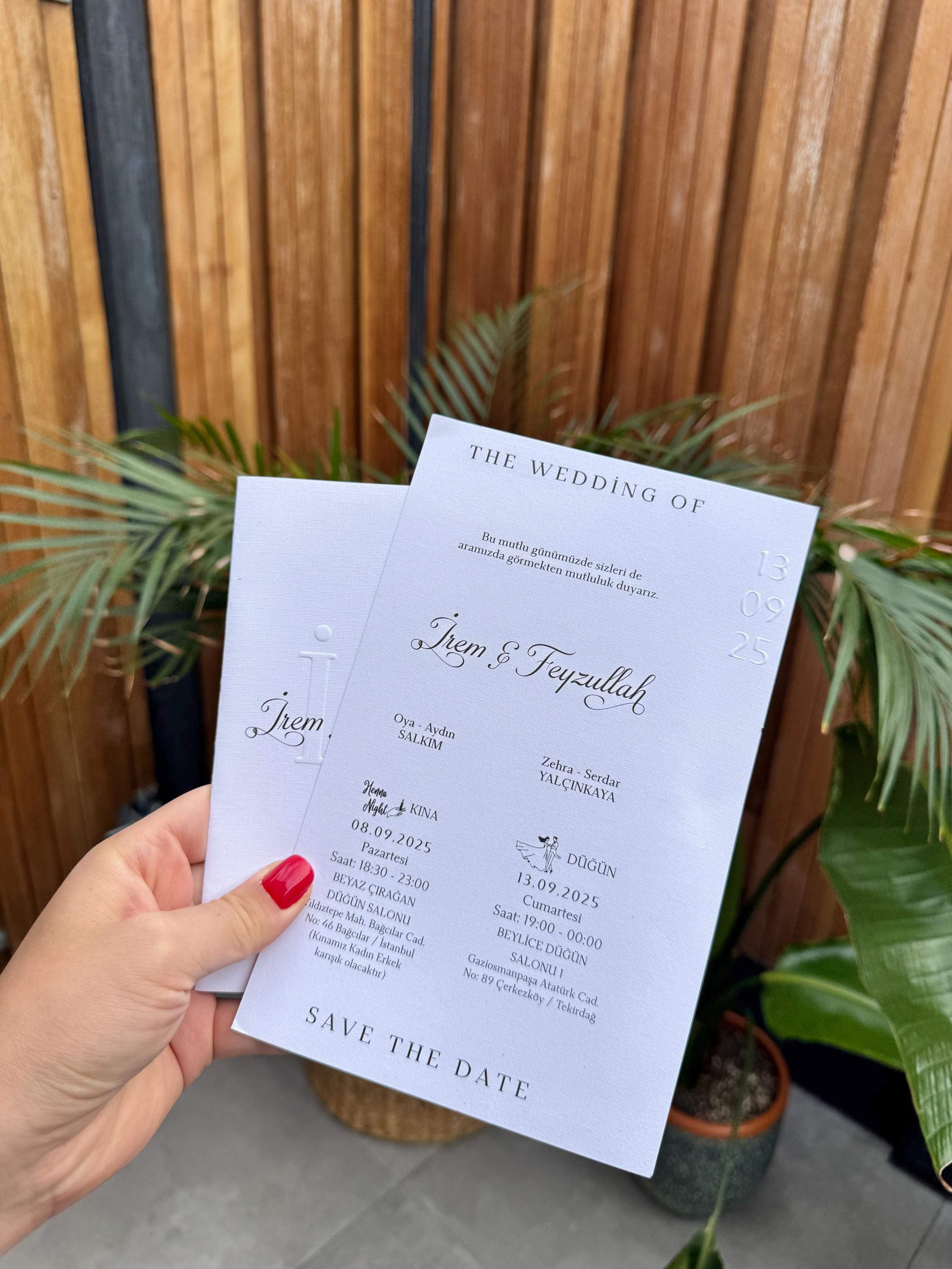 White Modern Wedding Invitation With Black Ribbon Embossed Text