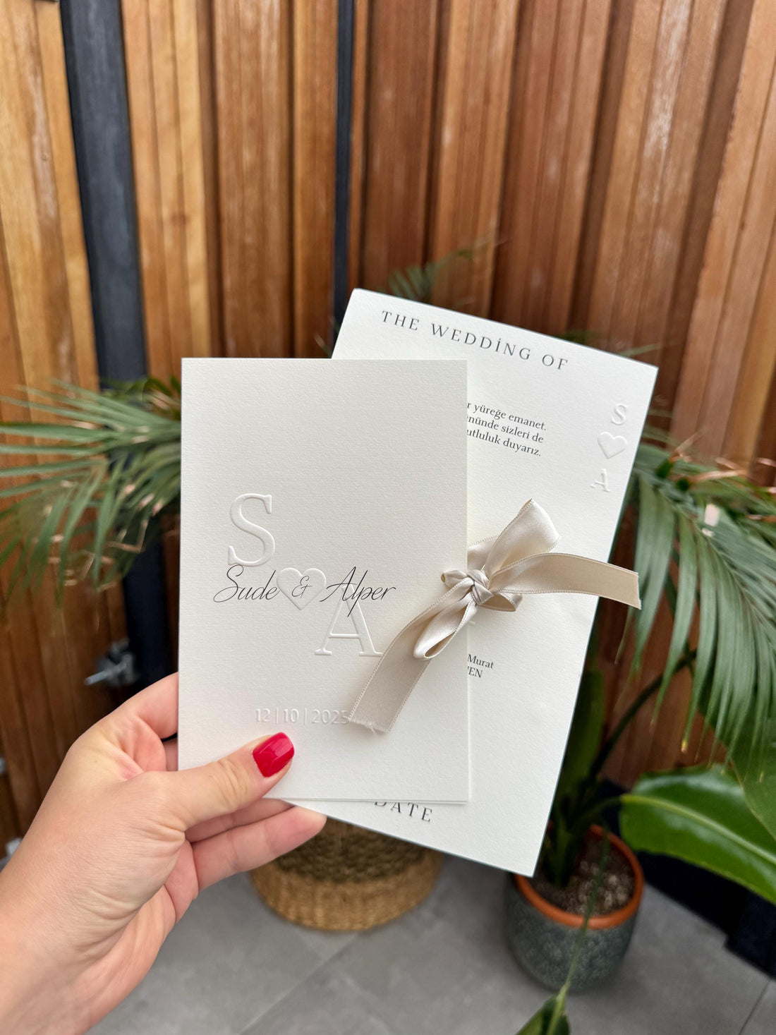 Cream Modern Wedding Invitation With White Ribbon Embossed Text