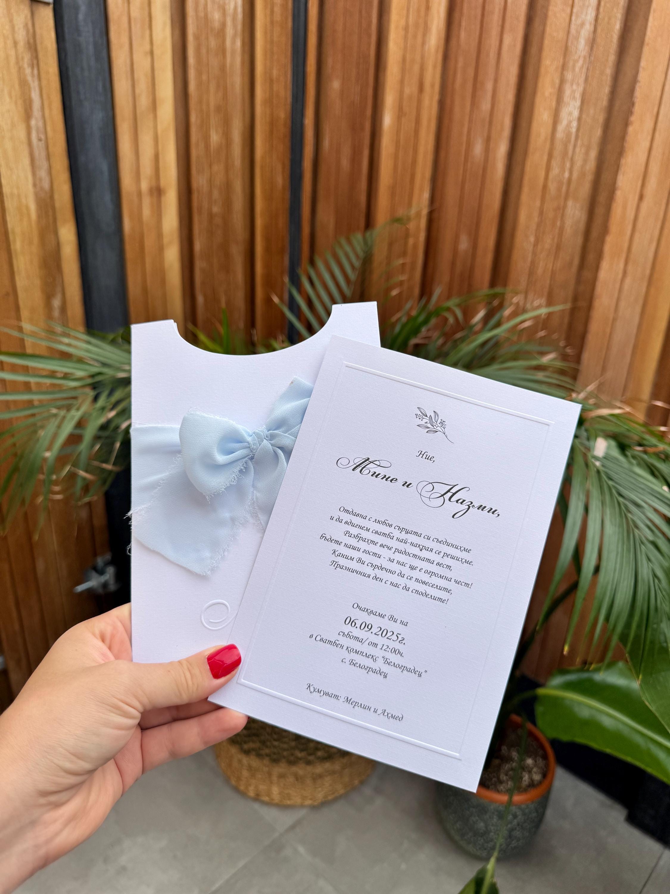 White Wedding Invitation With Blue Ribbon and Embossed Text