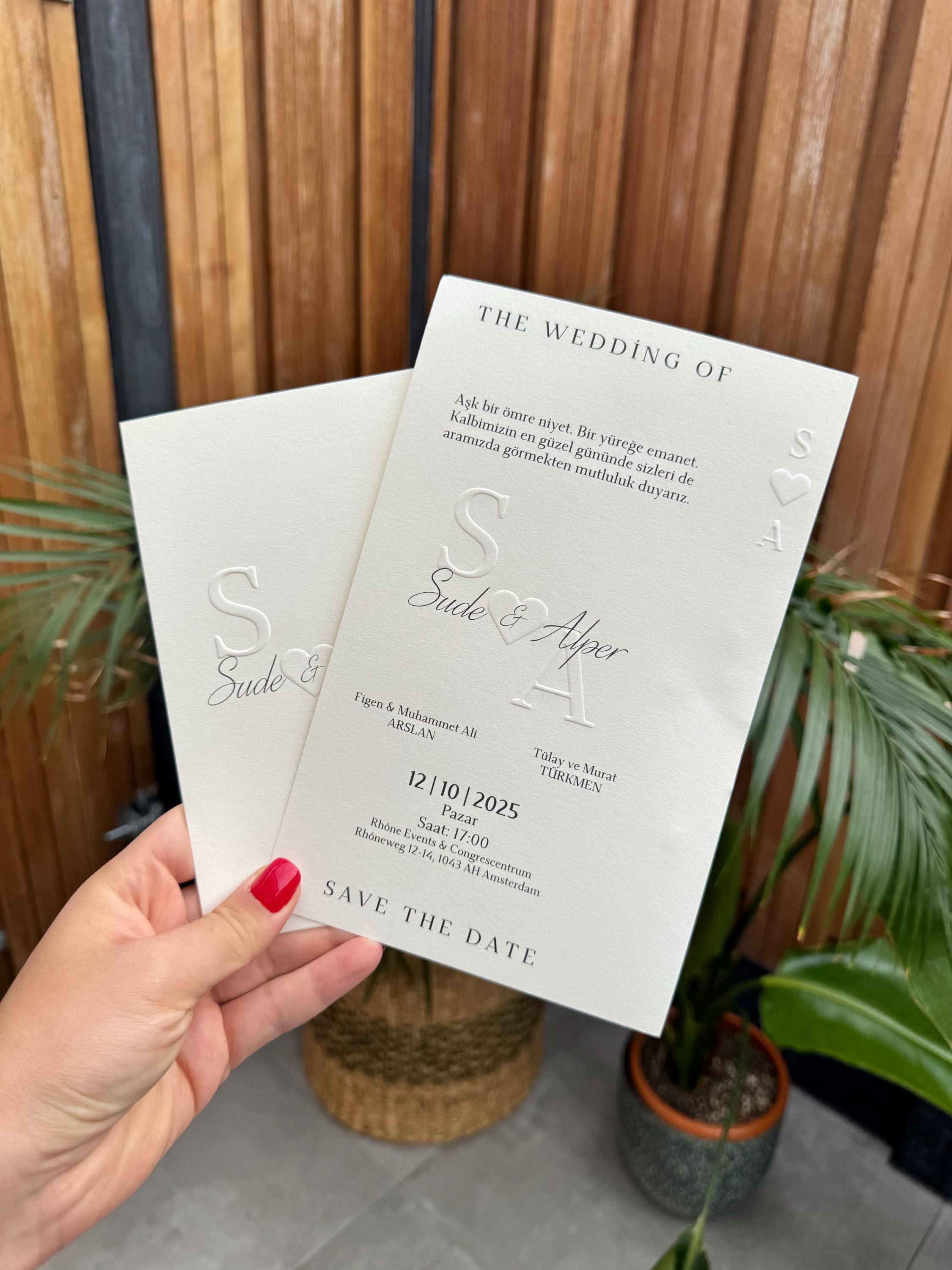Cream Modern Wedding Invitation With White Ribbon Embossed Text