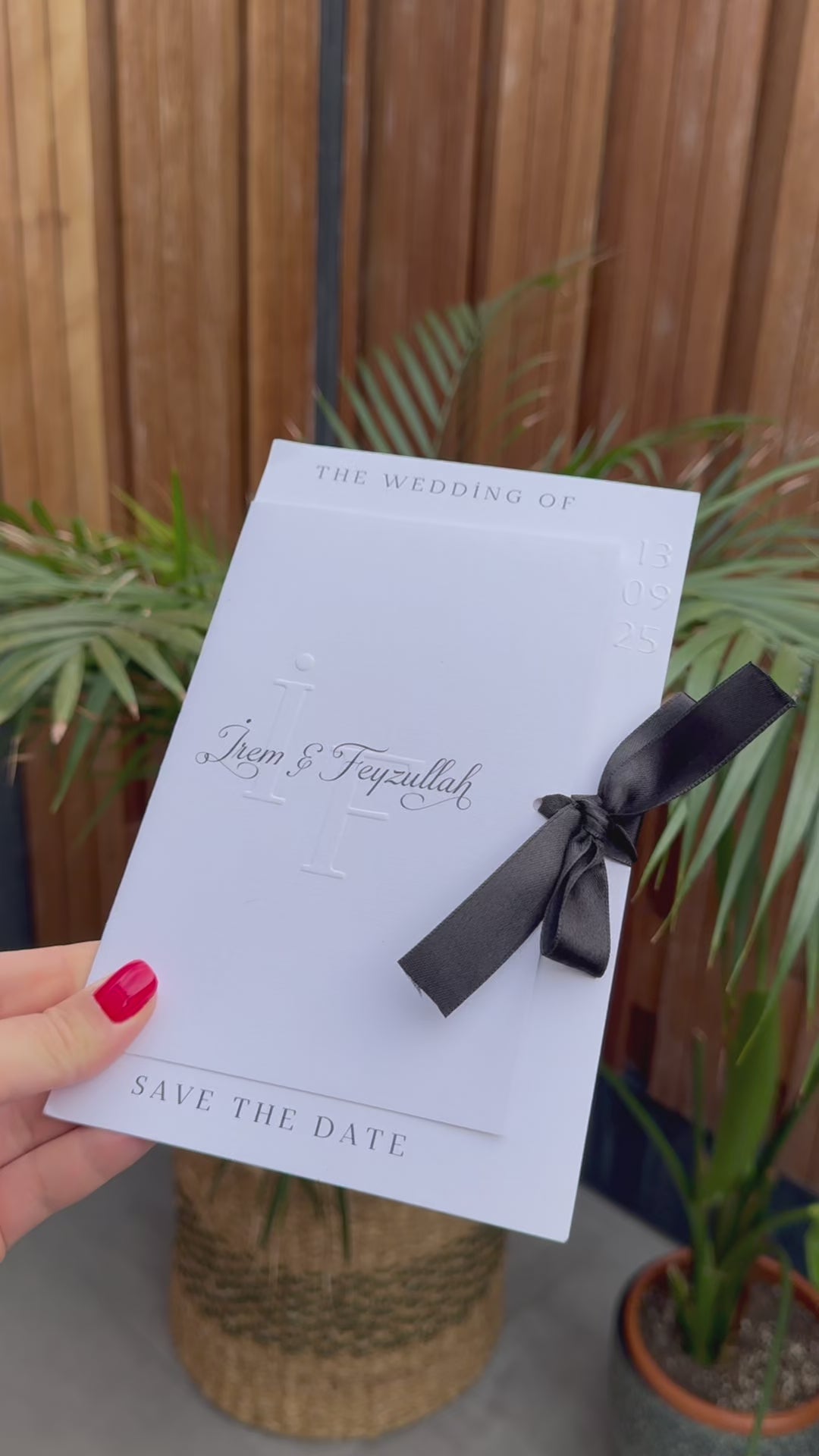 White Modern Wedding Invitation With Black Ribbon Embossed Text